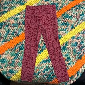 Athleta salutation stash pocket II printed tight size Medium/ Tall, 7/8 length